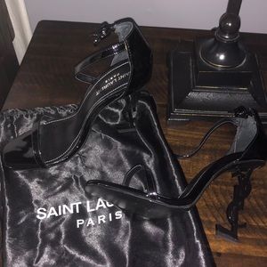 Black patent leather YSL sandal.